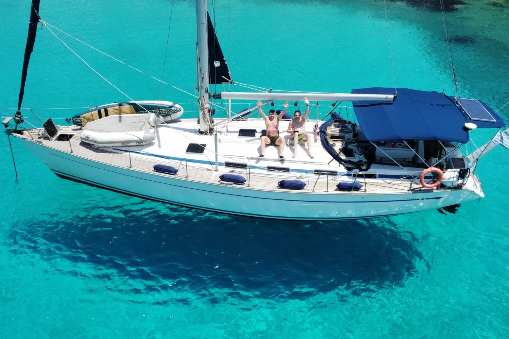 Kyknos Bavaria 50 sailing yacht anchored in crystal-clear waters of the Sporades