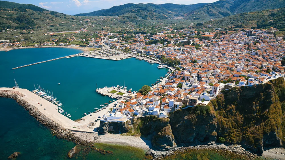 Aerial view of Skopelos Port and town – iconic stop on Sporades sailing routes.