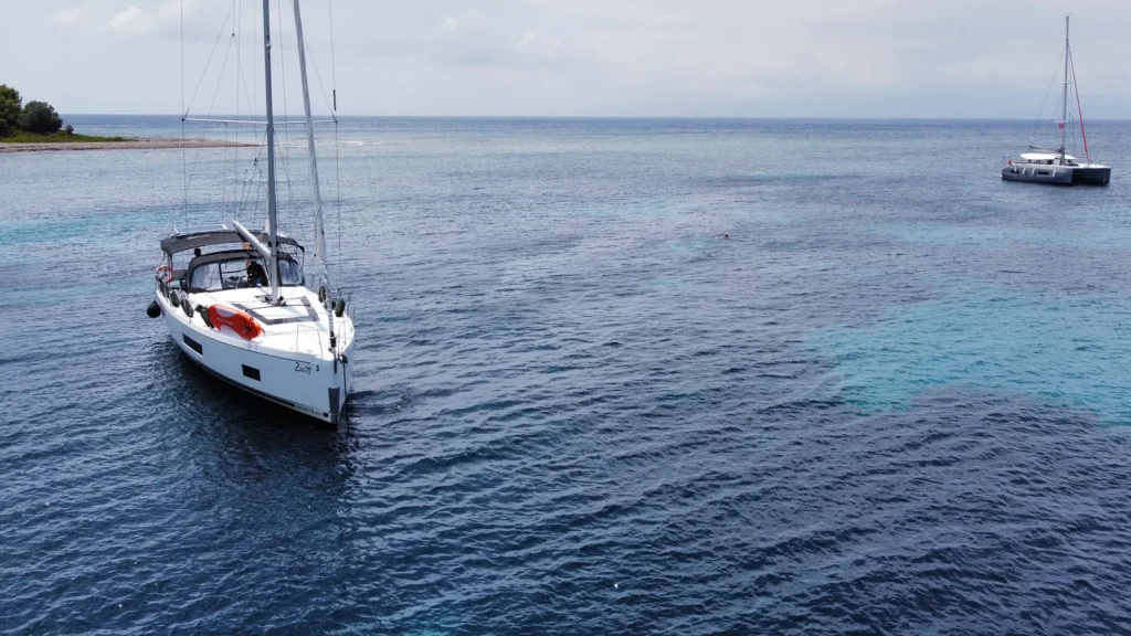 Luxury sailing yacht Zoe anchored in clear turquoise waters of the Sporades, viewed from above
